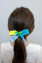 Blue and white bow on seamless hair tie