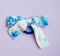 Blue and white bow on seamless hair tie